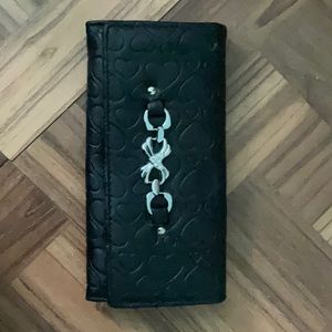 Y2K style wallet. Very cute and minimalist. Black heart patterns on the outside.